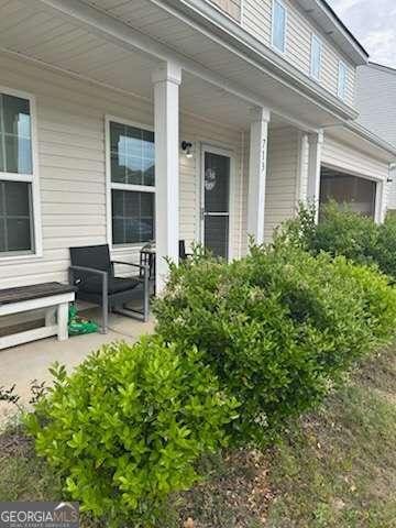 713 Dove Tree Ln, Social Circle, GA 30025 - view of exterior entry with covered porch