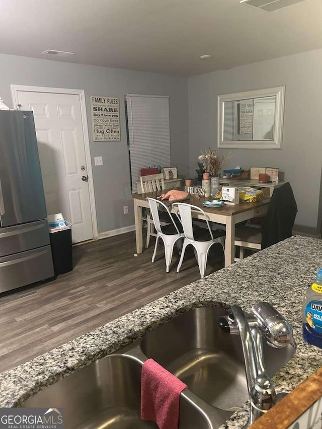 713 Dove Tree Ln, Social Circle, GA 30025 - interior space featuring baseboards, wood finished floors, and visible vents