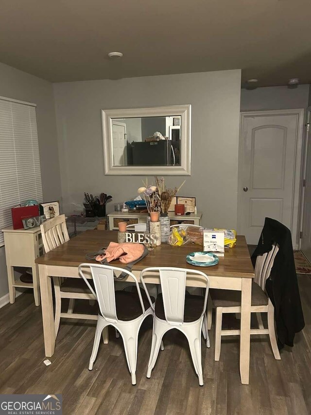 713 Dove Tree Ln, Social Circle, GA 30025 - dining room featuring dark wood-style flooring