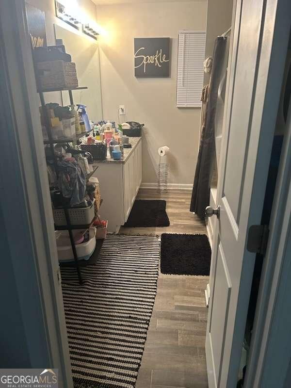 713 Dove Tree Ln, Social Circle, GA 30025 - bathroom featuring vanity and wood finished floors