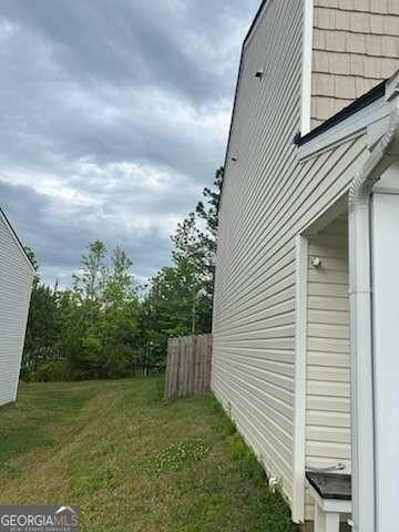 713 Dove Tree Ln, Social Circle, GA 30025 - view of side of property with a yard