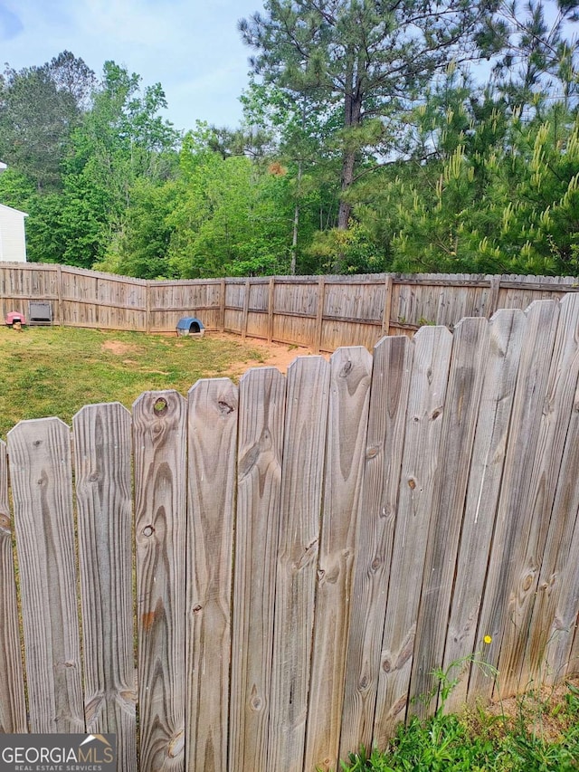 713 Dove Tree Ln, Social Circle, GA 30025 - exterior details with a fenced backyard