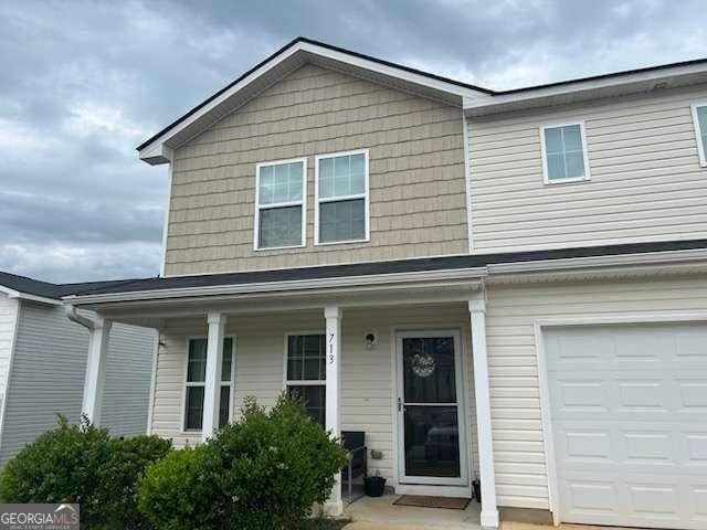 713 Dove Tree Ln, Social Circle, GA 30025 - traditional-style house with a porch