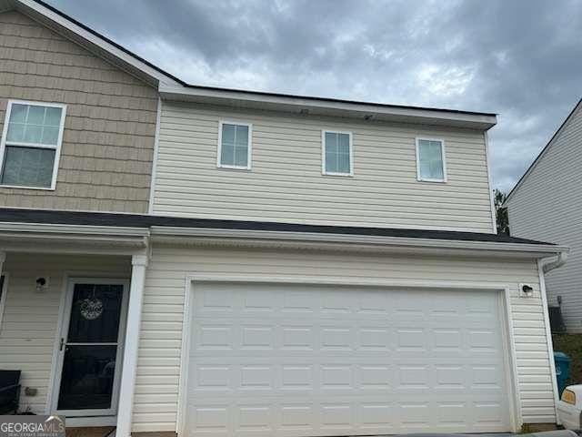 713 Dove Tree Ln, Social Circle, GA 30025 - view of front of home featuring an attached garage