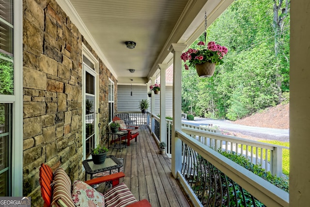 wooden deck featuring covered porch