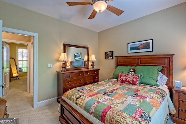bedroom with baseboards, ceiling fan, and light colored carpet