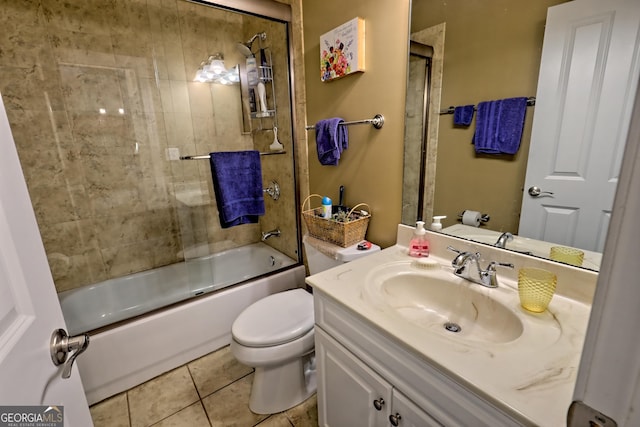 bathroom featuring tile patterned floors, bath / shower combo with glass door, vanity, and toilet