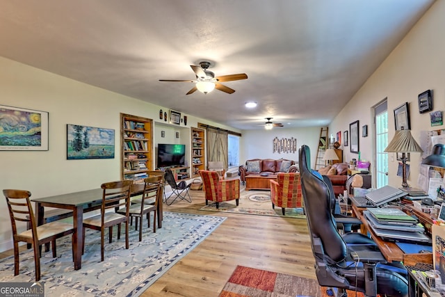office space featuring a ceiling fan and wood finished floors