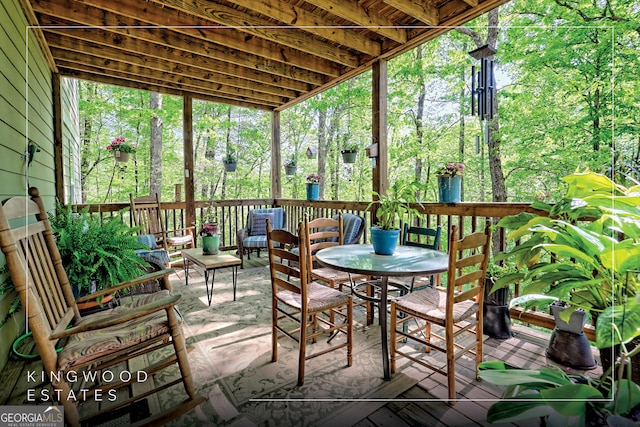 sunroom featuring outdoor lounge area