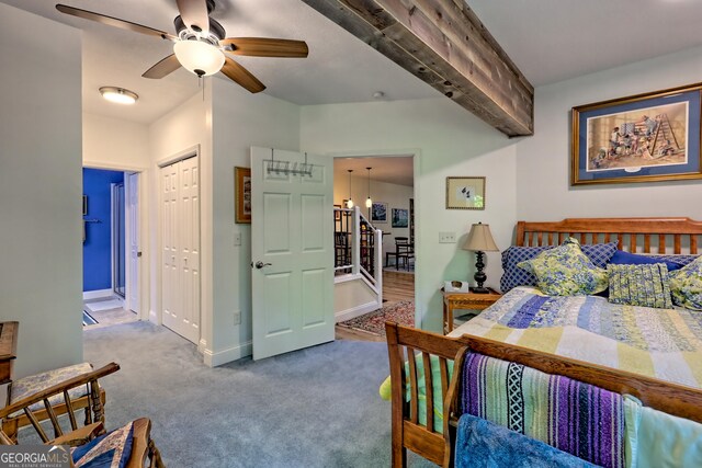 bedroom with carpet flooring, baseboards, ceiling fan, and a closet