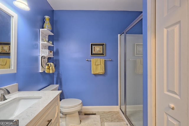 bathroom featuring visible vents, a stall shower, vanity, baseboards, and toilet