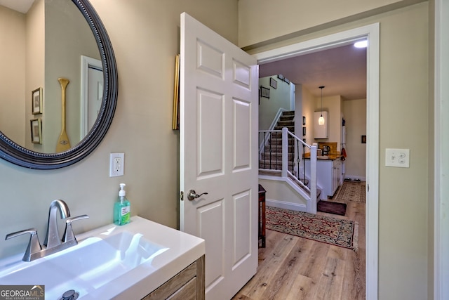 bathroom featuring vanity and wood finished floors