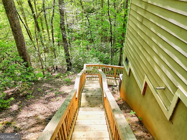 exterior space with a wooded view