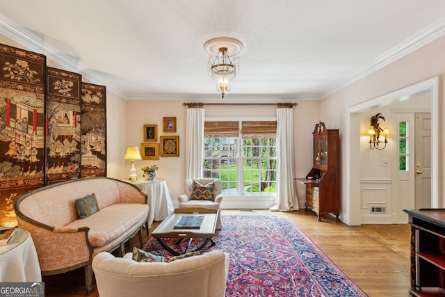 4584 E Conway Dr, Atlanta, GA 30327 - living area featuring crown molding, visible vents, and wood finished floors