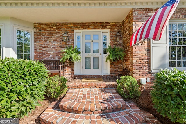4584 E Conway Dr, Atlanta, GA 30327 - view of exterior entry with brick siding and covered porch