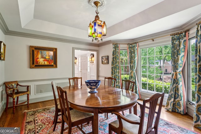 4584 E Conway Dr, Atlanta, GA 30327 - dining space featuring crown molding, a tray ceiling, and wood finished floors