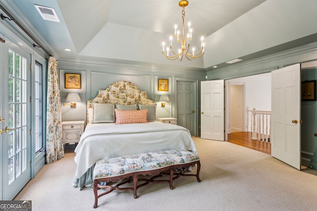 4584 E Conway Dr, Atlanta, GA 30327 - carpeted bedroom with visible vents, ornamental molding, a raised ceiling, and a chandelier