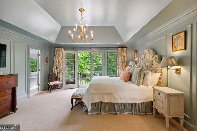 4584 E Conway Dr, Atlanta, GA 30327 - carpeted bedroom with lofted ceiling, a chandelier, and access to exterior