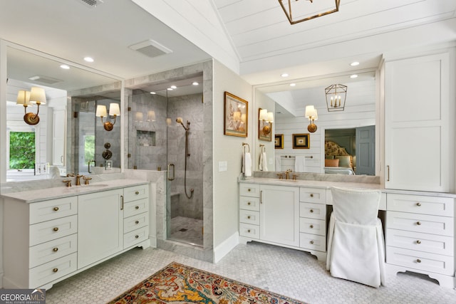 4584 E Conway Dr, Atlanta, GA 30327 - full bath featuring tile patterned floors, two vanities, a sink, and a stall shower