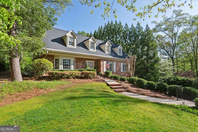 4584 E Conway Dr, Atlanta, GA 30327 - new england style home with brick siding and a front lawn