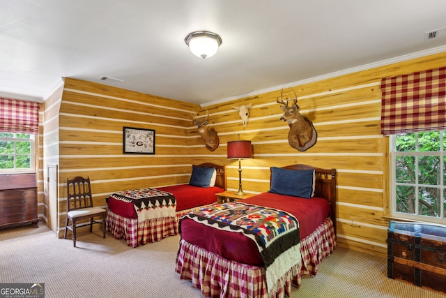 4584 E Conway Dr, Atlanta, GA 30327 - bedroom featuring wood walls, visible vents, and carpet