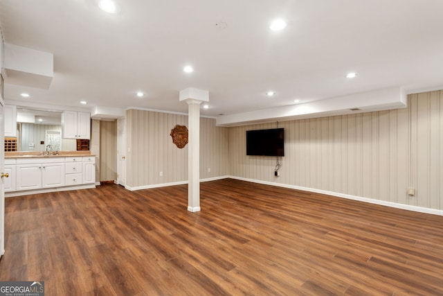 4584 E Conway Dr, Atlanta, GA 30327 - finished basement with recessed lighting, baseboards, dark wood finished floors, and a sink
