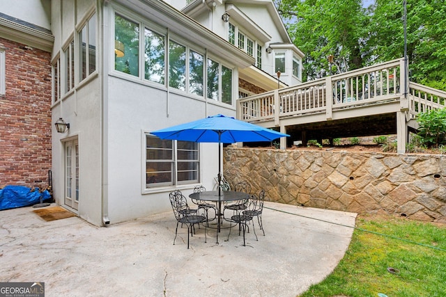 4584 E Conway Dr, Atlanta, GA 30327 - view of patio / terrace featuring outdoor dining space and a deck