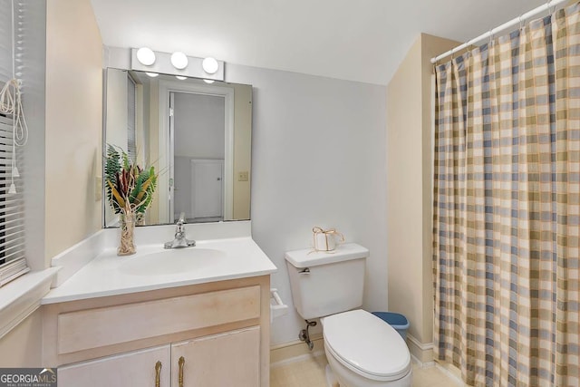 bathroom with vanity, toilet, and a shower with shower curtain