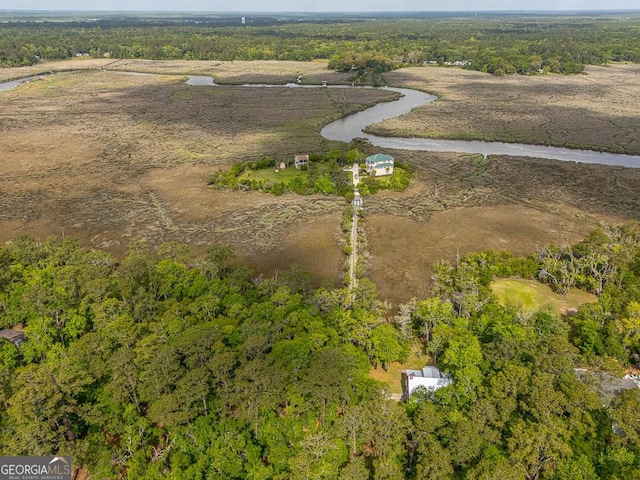 bird's eye view with a view of trees and a rural view