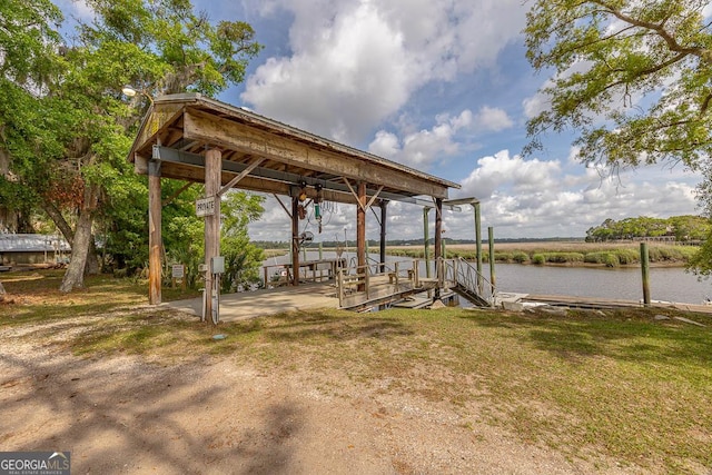 dock area featuring a water view and boat lift