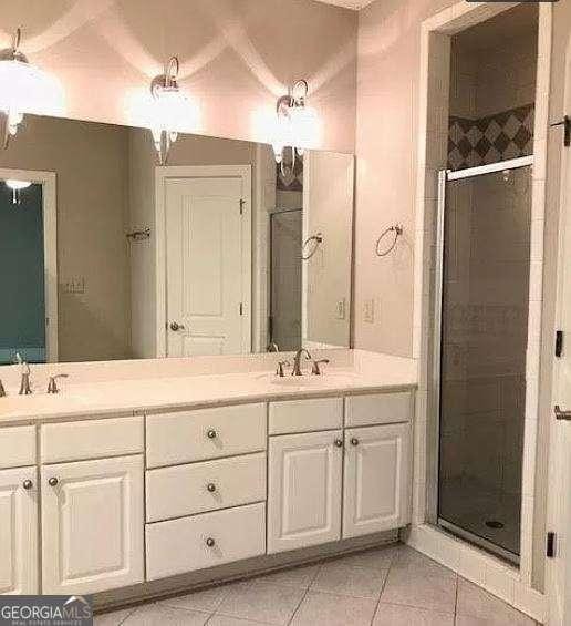 310 Research Dr Unit 802, Athens, GA 30605 - full bath with a sink, tile patterned flooring, a stall shower, and double vanity