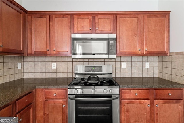 145 Redsage Rdg, Atlanta, GA 30349 - kitchen featuring stainless steel appliances and brown cabinetry