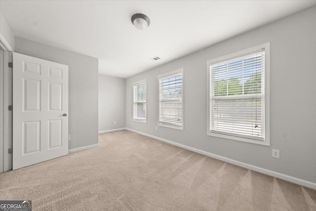 145 Redsage Rdg, Atlanta, GA 30349 - unfurnished bedroom featuring baseboards and carpet floors
