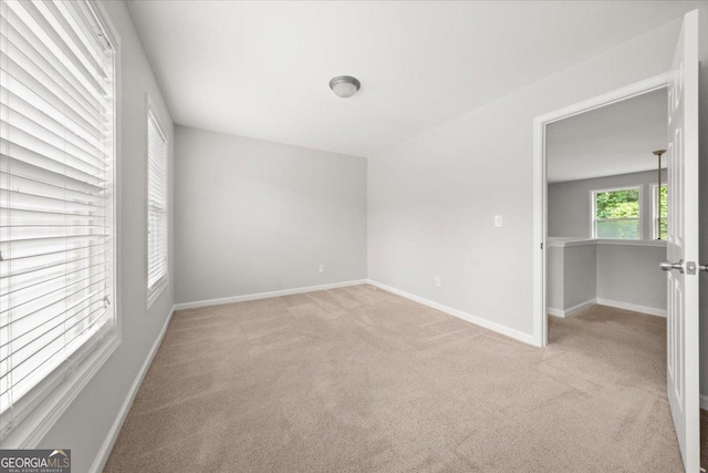 145 Redsage Rdg, Atlanta, GA 30349 - carpeted empty room featuring baseboards