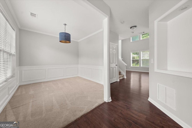 145 Redsage Rdg, Atlanta, GA 30349 - corridor featuring wood finished floors, stairway, crown molding, and a wainscoted wall