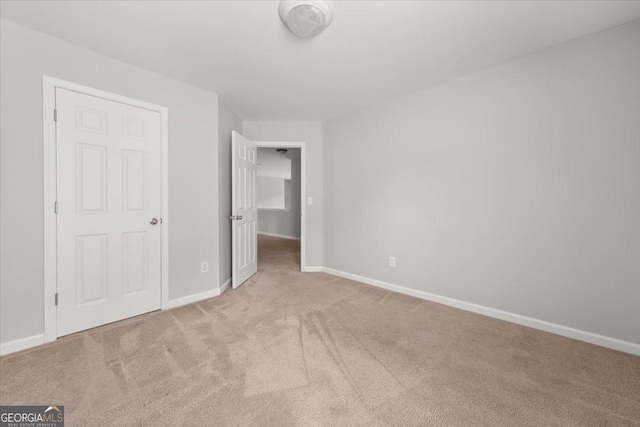 145 Redsage Rdg, Atlanta, GA 30349 - unfurnished bedroom with carpet floors and baseboards