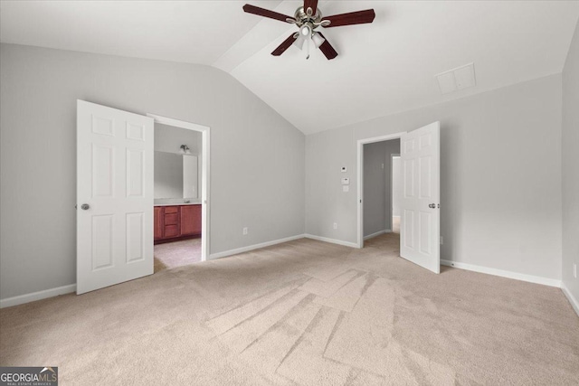 145 Redsage Rdg, Atlanta, GA 30349 - unfurnished bedroom featuring lofted ceiling, light carpet, ensuite bath, and baseboards