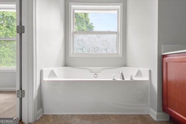 145 Redsage Rdg, Atlanta, GA 30349 - full bath with a bath, plenty of natural light, and baseboards