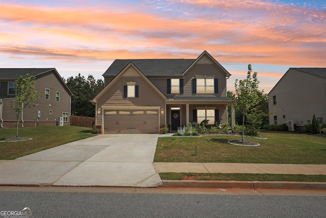 traditional-style home featuring concrete driveway and an attached garage