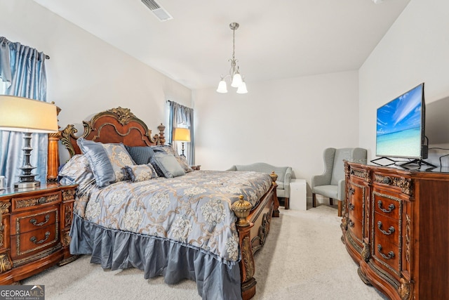 bedroom featuring carpet and a chandelier