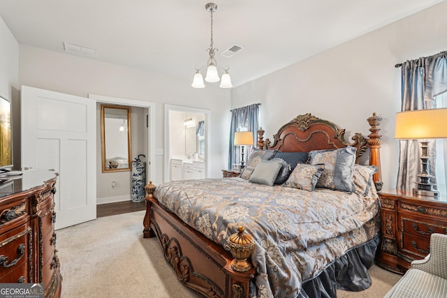 bedroom featuring a chandelier, light carpet, baseboards, and ensuite bathroom
