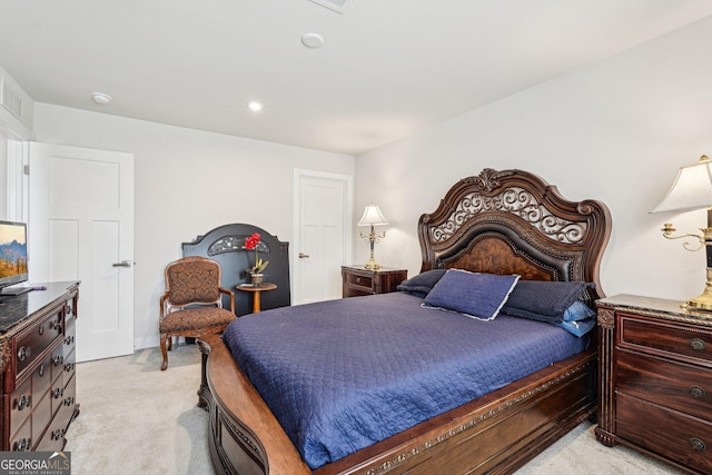 bedroom with light colored carpet