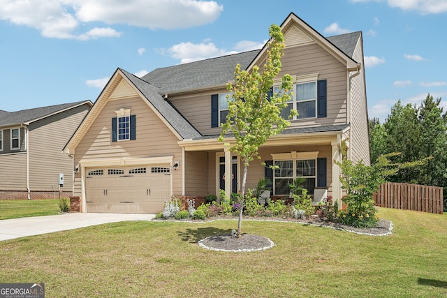 traditional home with driveway, an attached garage, covered porch, and roof with shingles