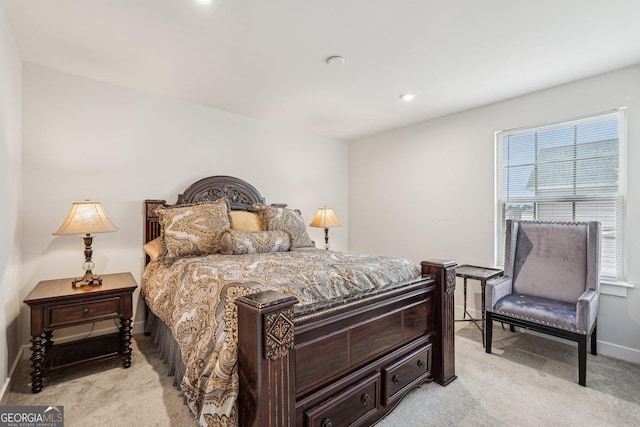 bedroom featuring light colored carpet, baseboards, and recessed lighting