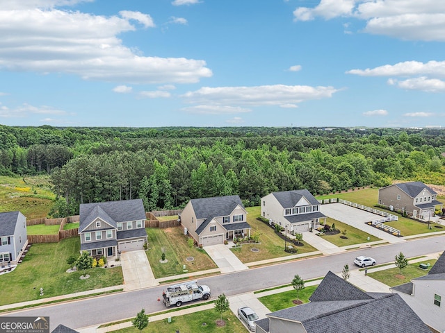 aerial perspective of suburban area with a heavily wooded area