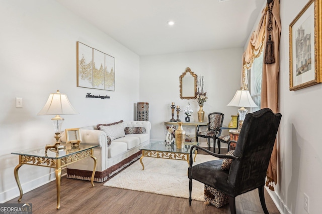 living area featuring wood finished floors, baseboards, and recessed lighting