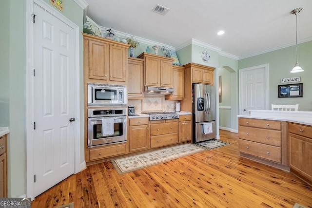 kitchen featuring visible vents, stainless steel appliances, light wood-type flooring, and under cabinet range hood