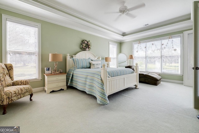 bedroom featuring crown molding, carpet, and multiple windows