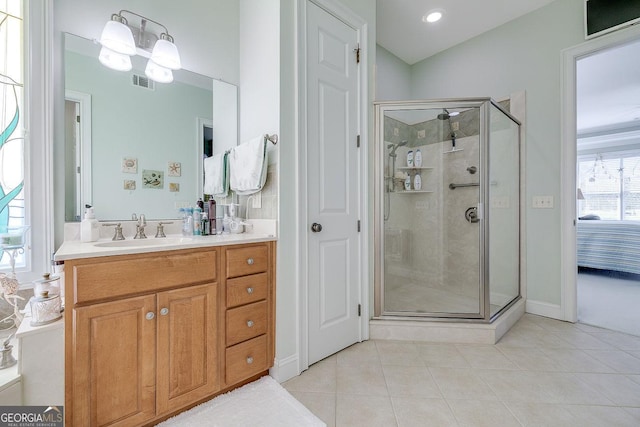 full bath featuring visible vents, tile patterned flooring, a shower stall, vanity, and ensuite bathroom