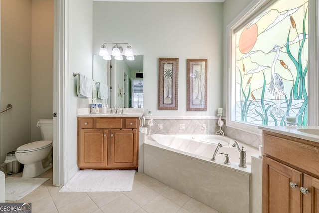 full bathroom with vanity, tile patterned flooring, toilet, and a bath